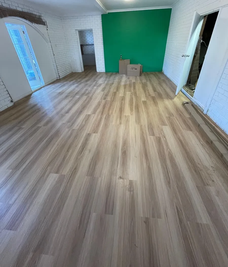 Large open-plan area with newly installed flooring